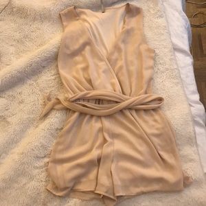 Tan romper with low neckline